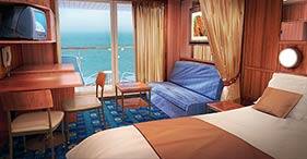 Norwegian Dawn cruise ship Mini-Suite with sitting area, private balcony, and lu