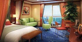 Norwegian Dawn cruise ship Romance Suite with living area, private balcony, dini