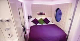 Norwegian Epic cruise ship Studio Stateroom with two beds, flat screen TV.