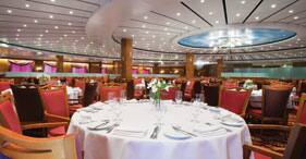Norwegian Sun cruise ship Four Seasons Main Dining Room with panoramic views.