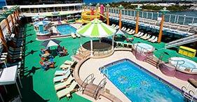 Norwegian Jade cruise ship Pool with slides, hot tubes, and deck chairs.
