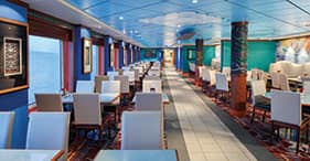 Pride of America cruise ship Aloha Café with indoor and outdoor seating and a ki