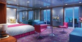 Pride of America cruise ship Penthouse with king-sized bed, living room, and pri