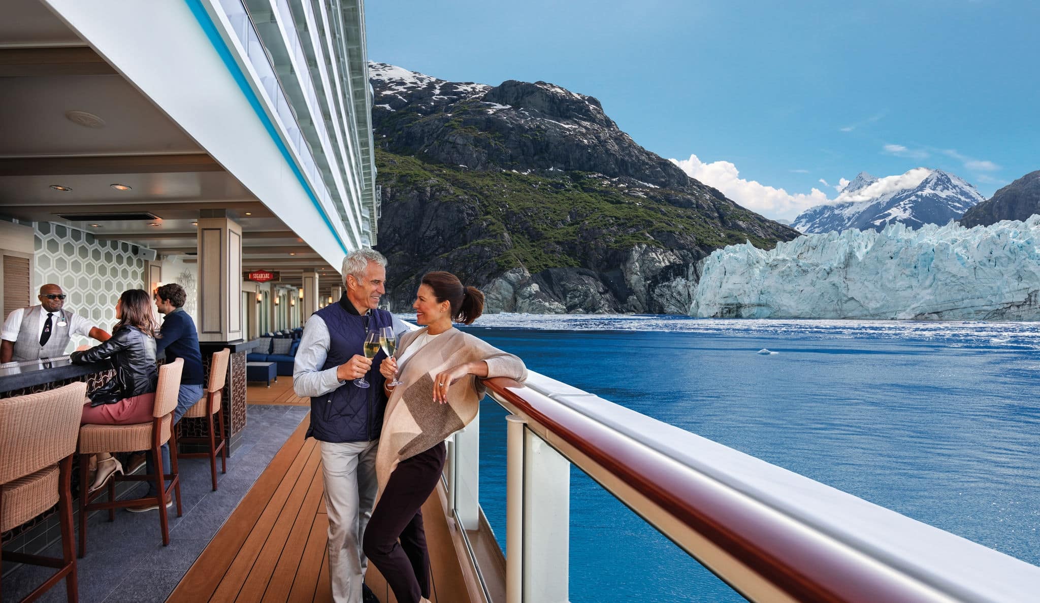 Couple leaning on railing of ship.