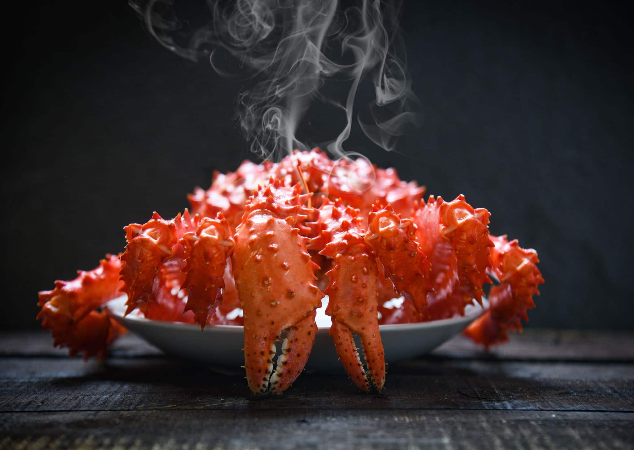 Red crab hokkaido / Alaskan king crab cooked steam or boiled seafood on dark background