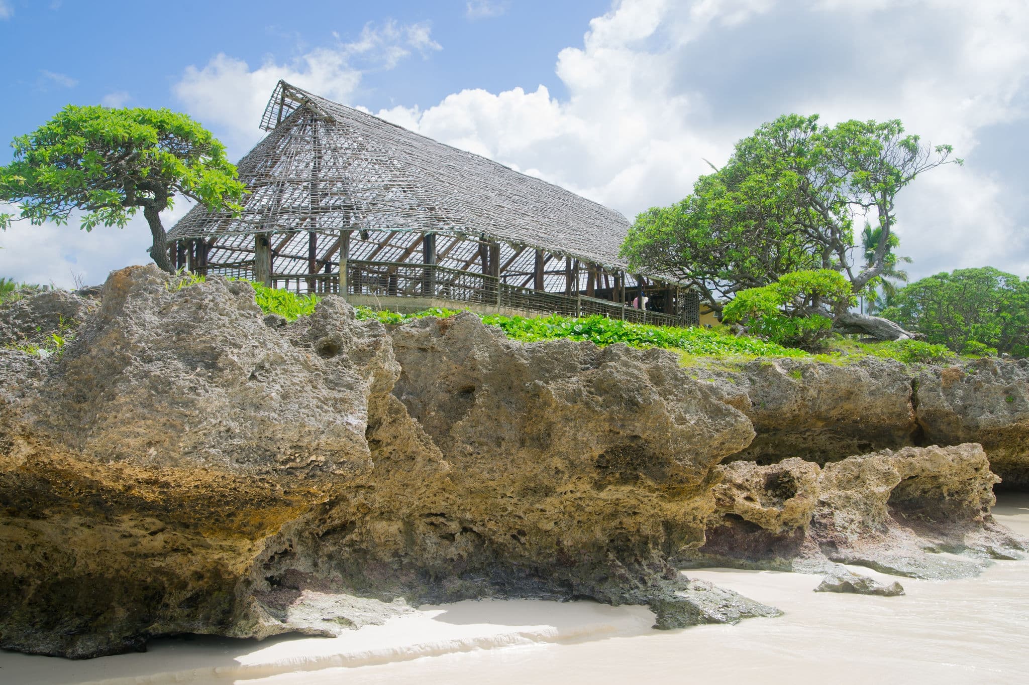 Thatch roof meeting house on the beach near Noumea in New Caledonia archipelago