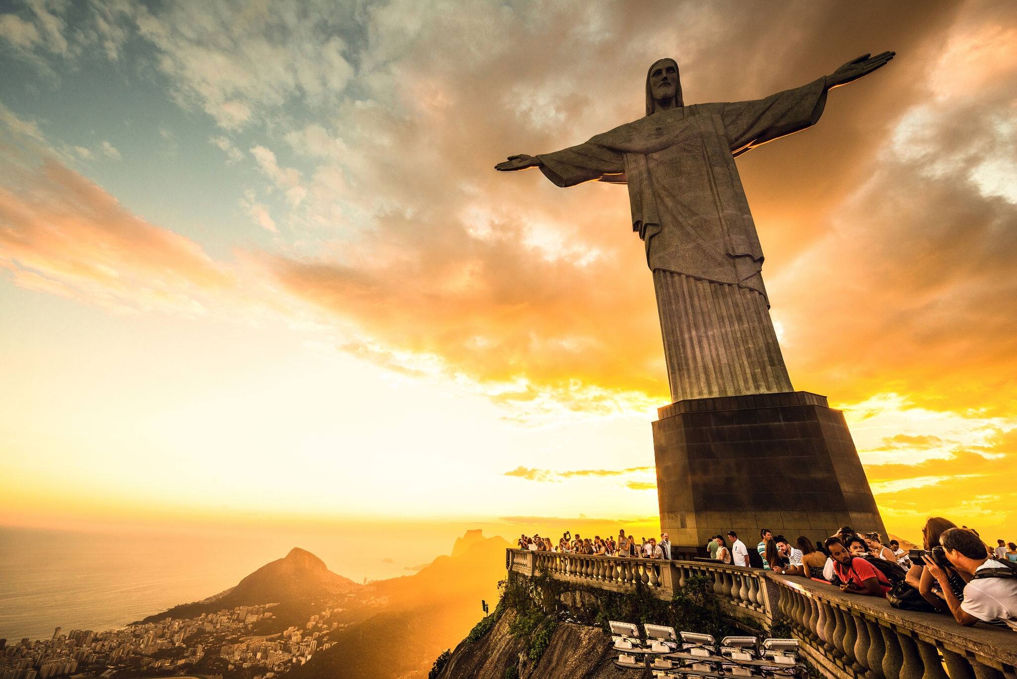 RIO DE JANEIRO, MARCH 3: Tourists are happy to see the first sunset after a week of rain and thunderstorms on the Corcovado Hill - march 3, 2013 in Rio de Janeiro, Brazil