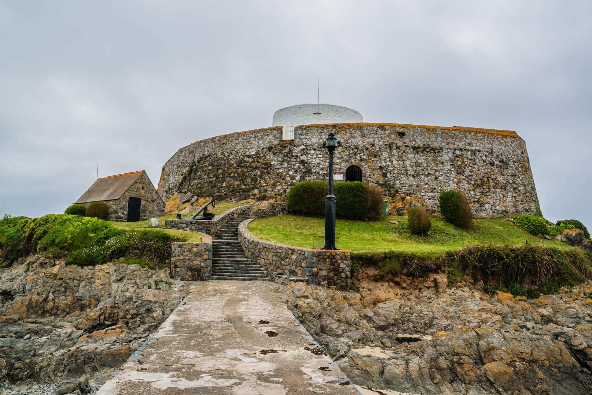 Fort Grey with Martello Tower built in 1804 on a small tidal islet to defend Rocquaine Bay. Saint Peter Port - capital of Guernsey - British Crown dependency in English Channel off coast of Normandy.