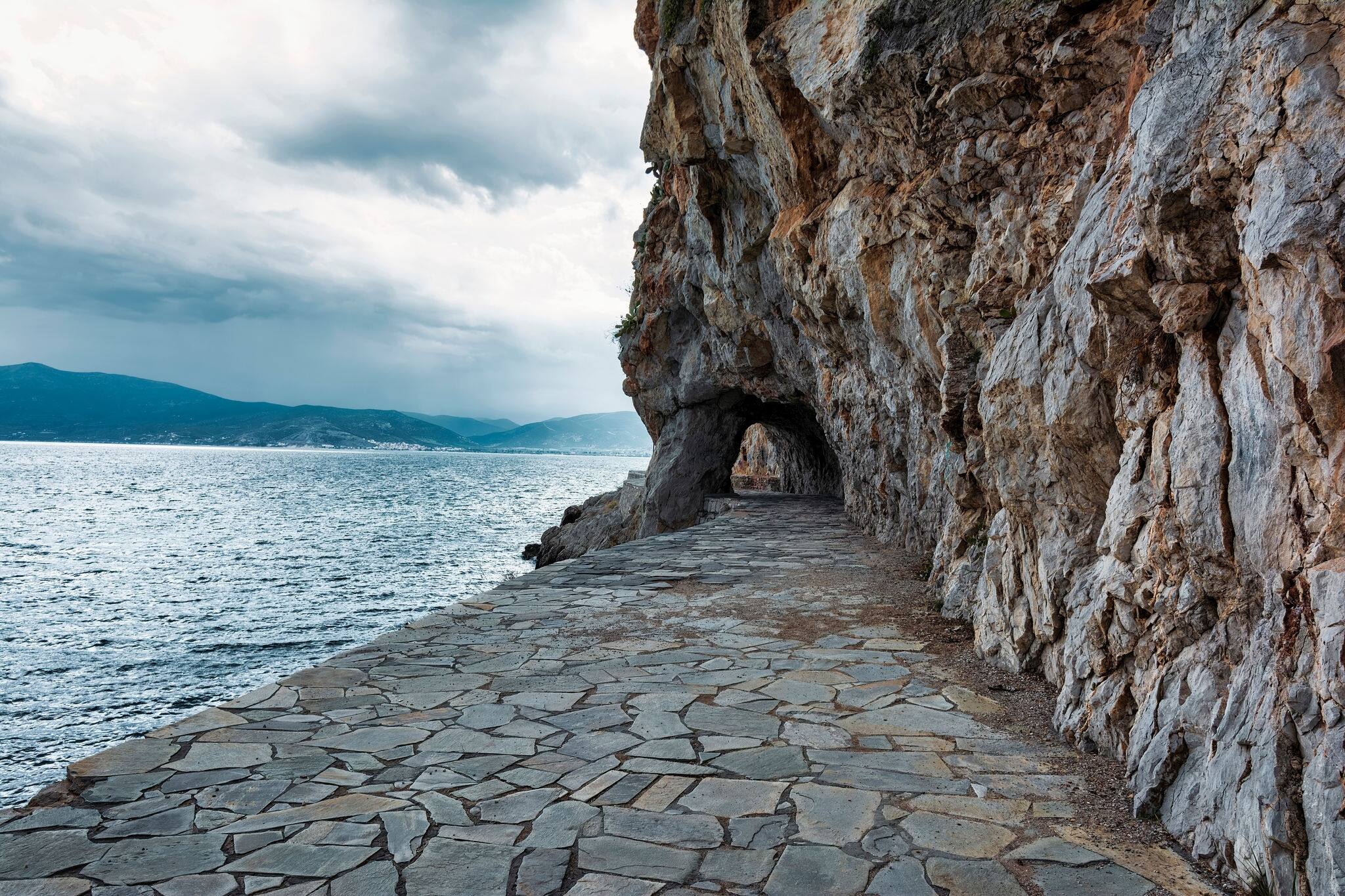Nafplio, Greece. Walking path by the sea. The promenade of Arvanitia as Nafplio inhabitants call it is one of the most beautiful walks that Nafplion has for everyone.