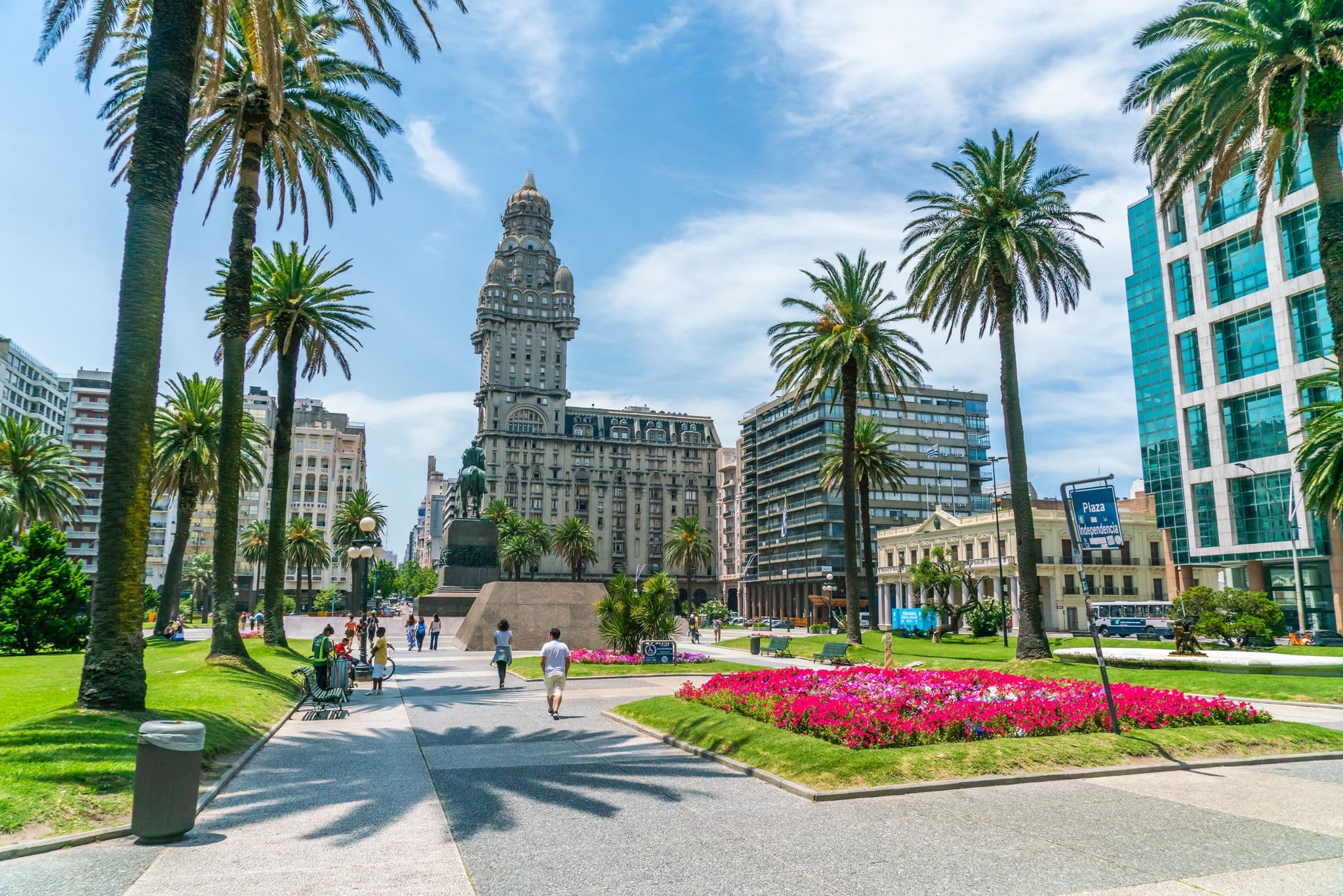 Tourists passing the statue of General Artigas on the Independance square (Plaza Indepencia), Montevideo, Uruguay, January 26th 2019