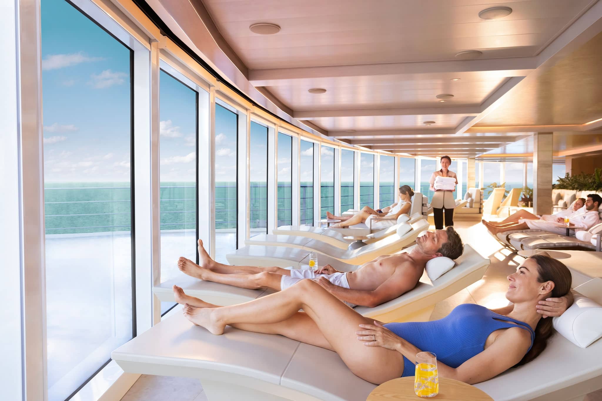 People relaxing on heated loungers in the Spa