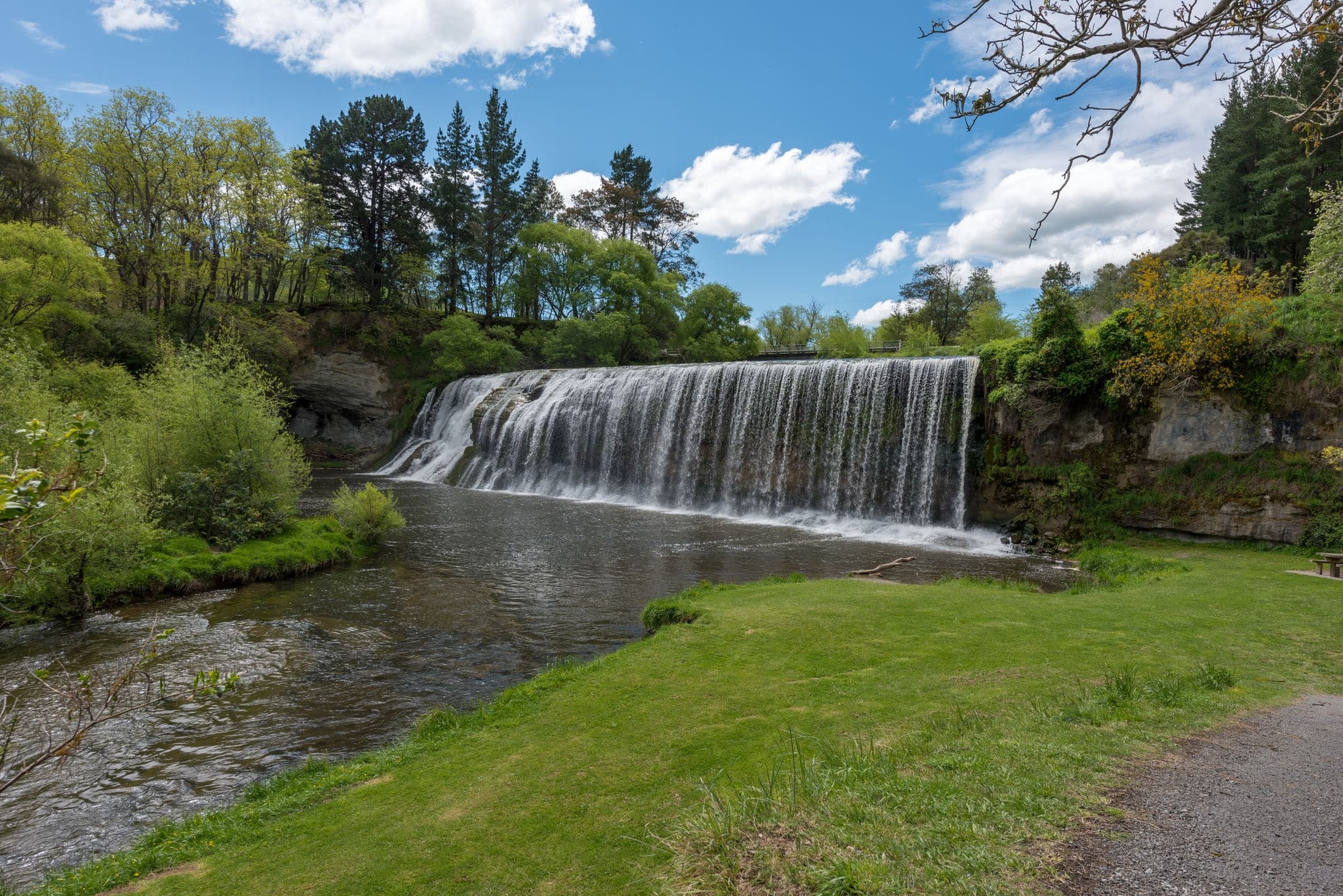 Rere waterfalls under blue skies in New Zealand