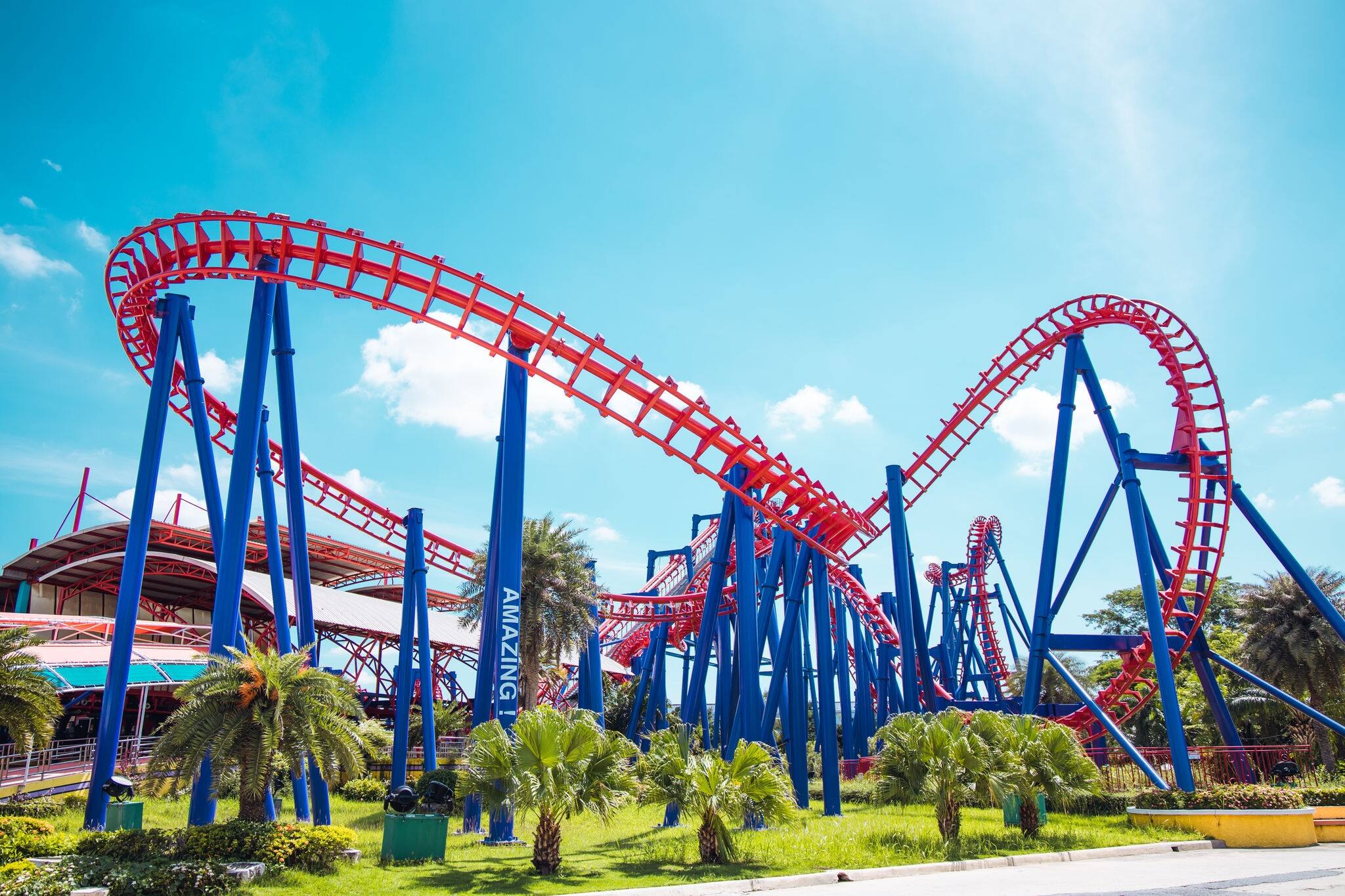 Roller coaster exciting fun amusement railroad track ride in Theme park.