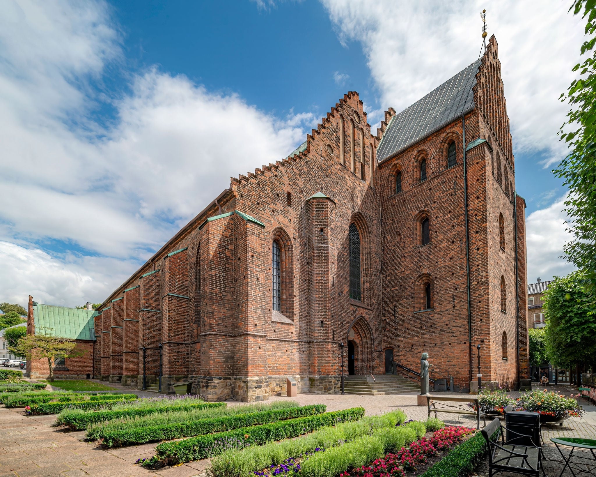 The exterior of St. Mary's Church with beautiful green courtyard. Helsingborg, Sweden.