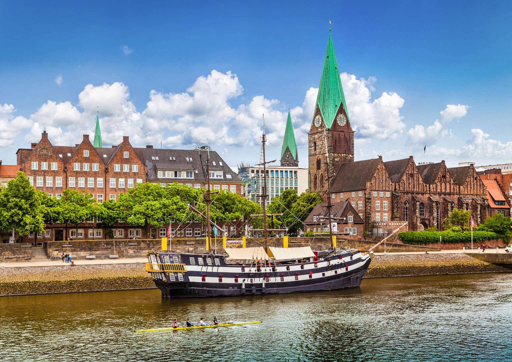 Historic town of Bremen with old sailing ship on Weser river, Germany