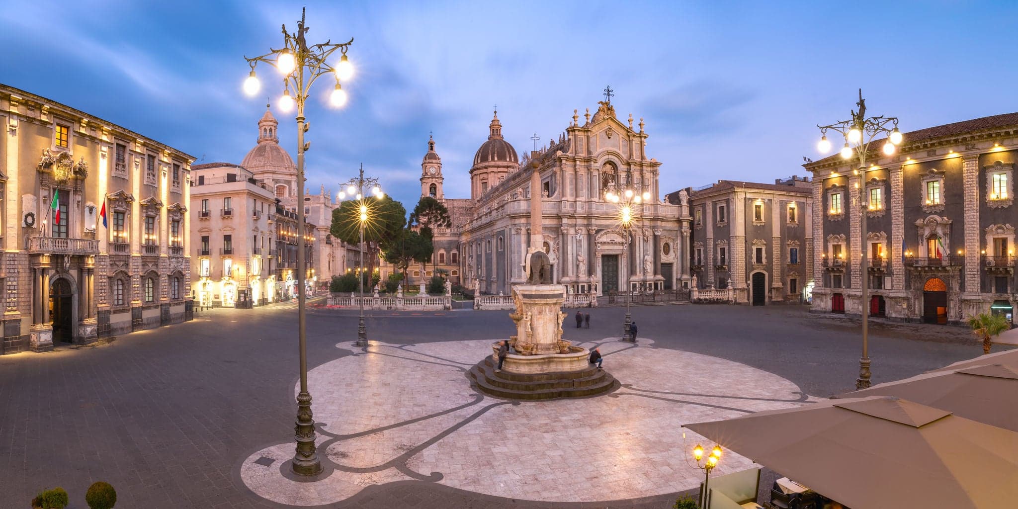 Panoramic aerial view of Piazza Duomo in Catania with the Cathedral of Santa Agatha and Liotru, symbol of Catania, at night, Sicily,