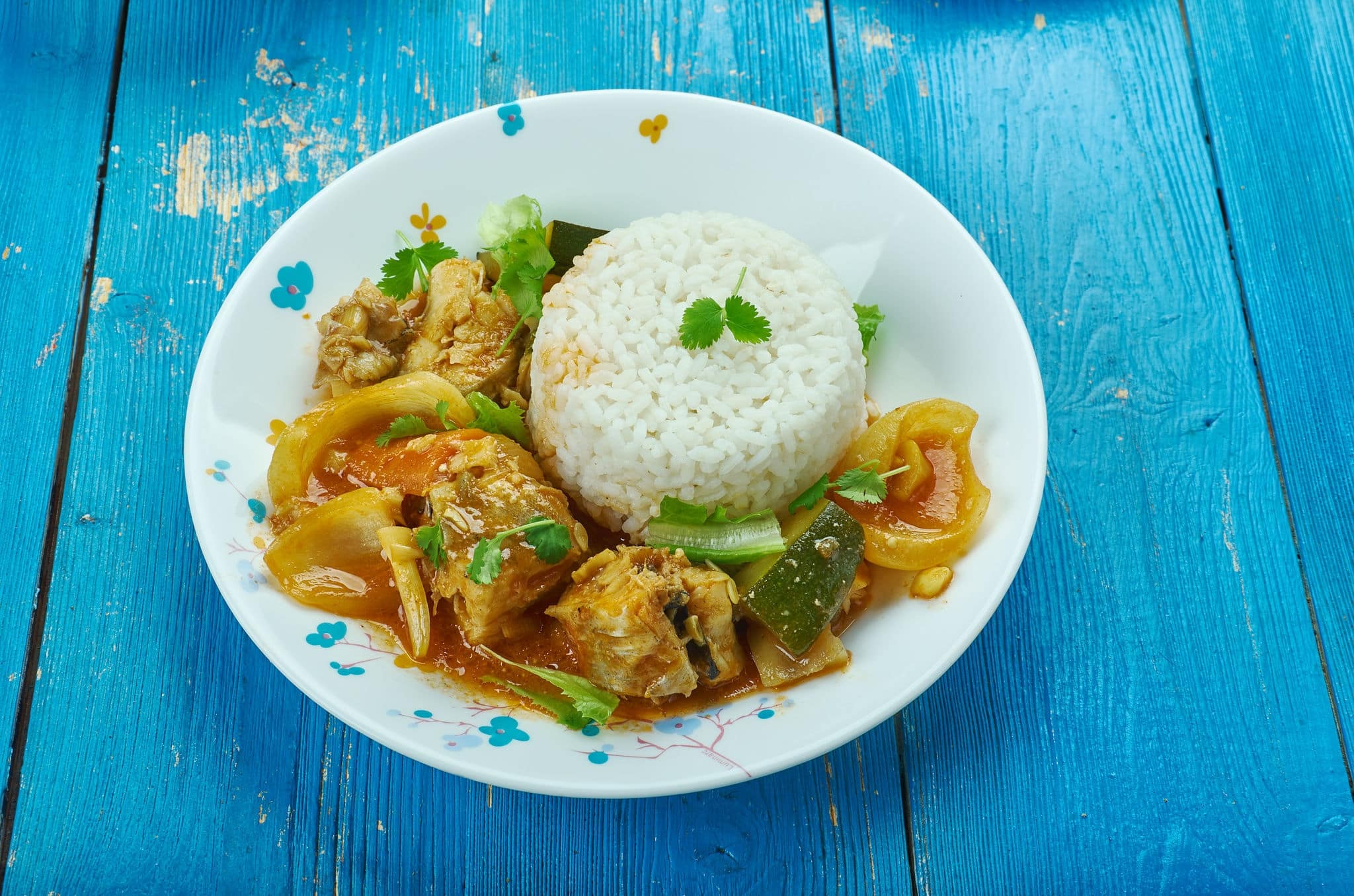 Seychelles fish curry  with coconut rice , traditional Seychellois recipe for a typical curry of red snapper cooked in fish stock.