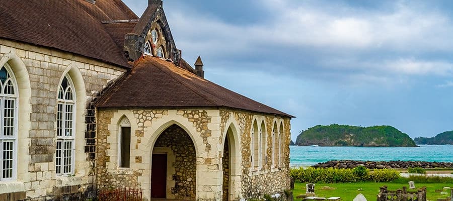 Saint Mary Parish Church in Port Maria, Jamaica, an Anglican house of worship with a graveyard, on the beach coast of the town. This brick and mortar building structure was built in the 19th century.