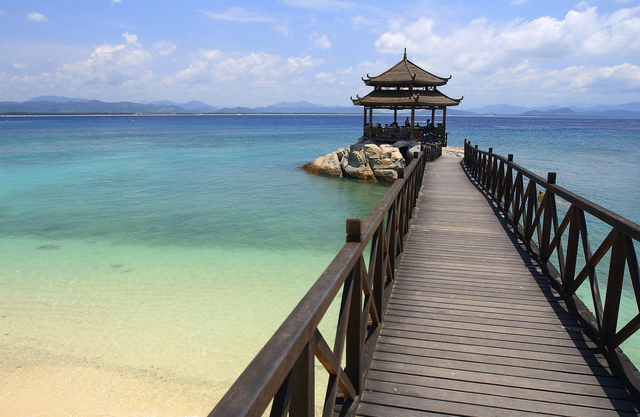 Footbridge to pavilion at beach of Wuzhizhou Island