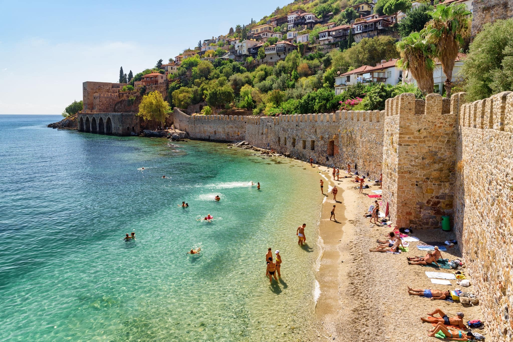Alanya, Turkey - October 5, 2021: Awesome view of the Tersane and the beach by the coast of Alanya, Turkey. Amazing coastline. The ancient shipyard is a popular tourist attraction in Turkey.