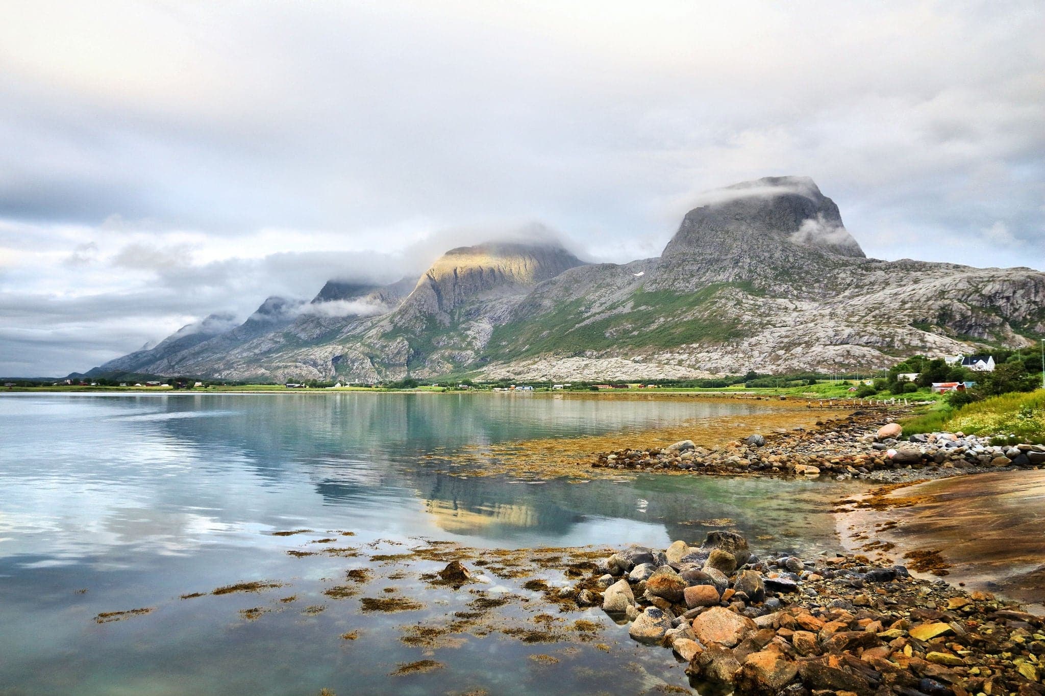 Seven Sisters, Norway. Mountain range in Sandnessjoen on Alsten Island. Sunset light.