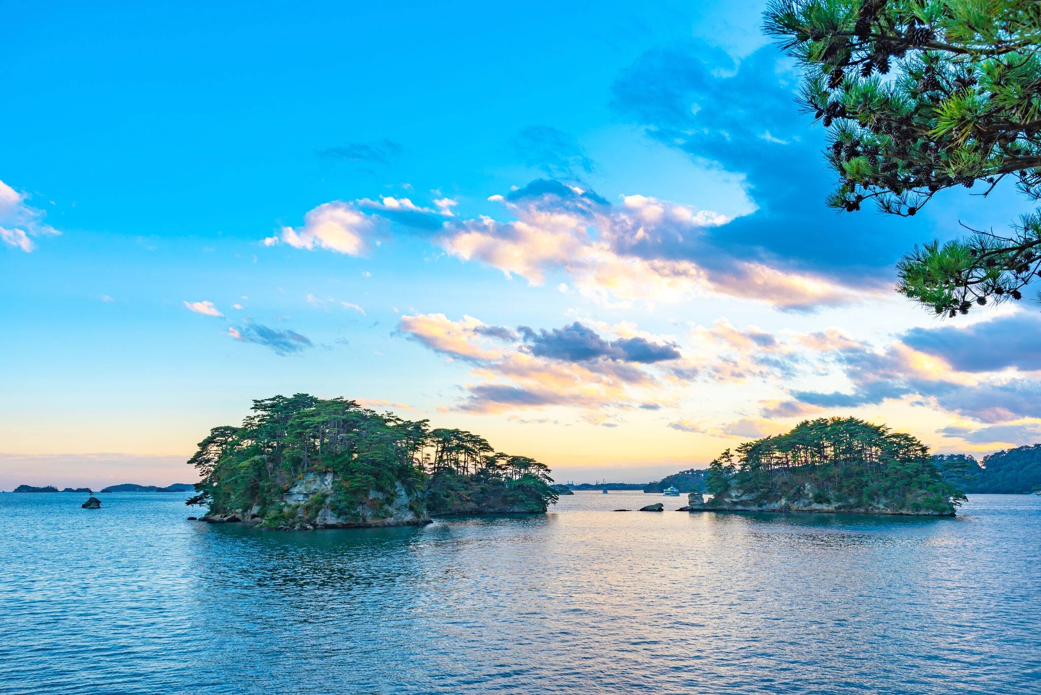 Matsushima Bay in dusk, beautiful islands covered with pine trees and rocks. One of the Three Views of Japan, and is also the site of the Zuigan-ji, Entsu-in and Kanrantei. in Miyagi Prefecture, Japan