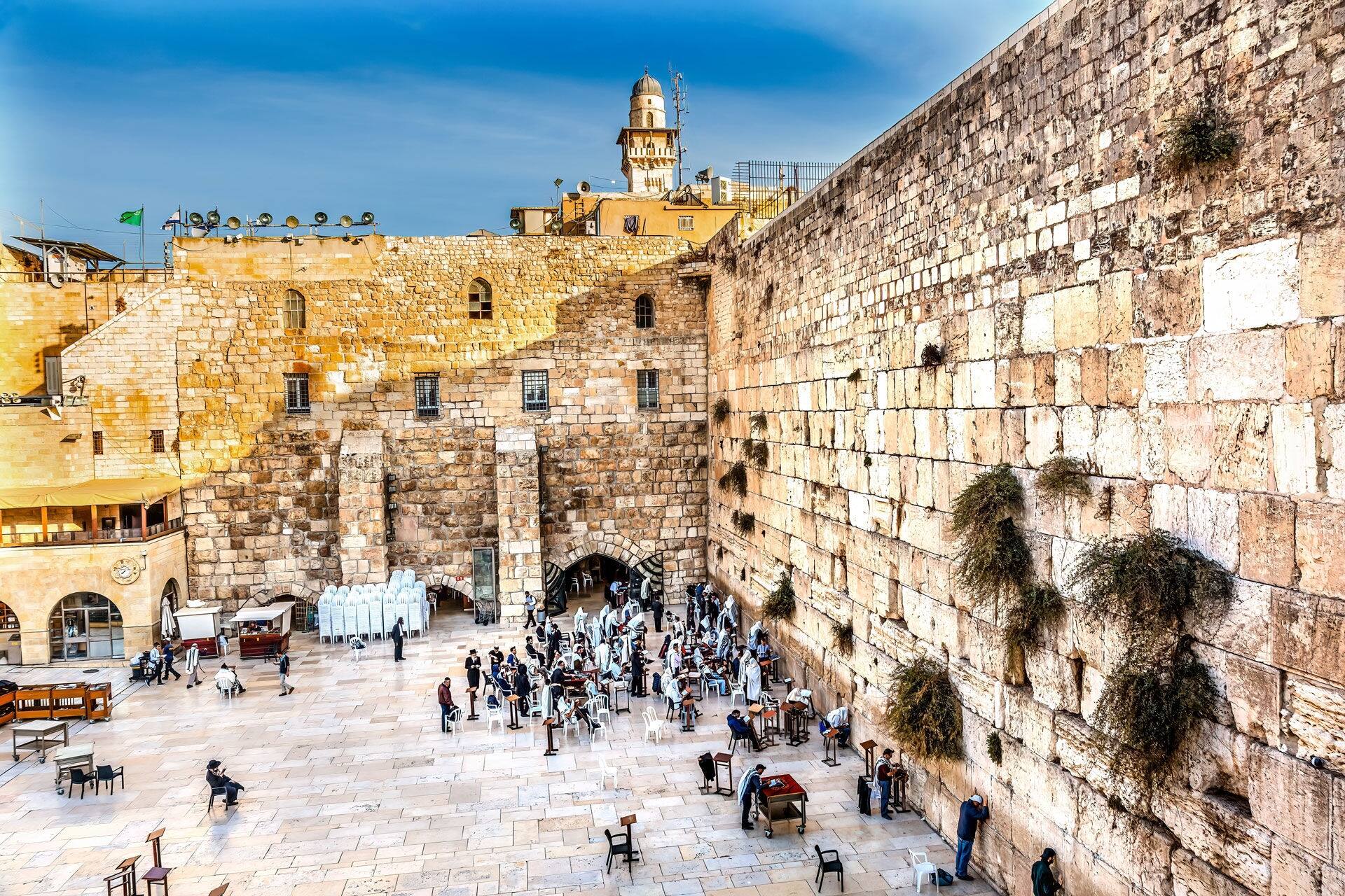 Praying at the Western"Wailing" Wall of Ancient Temple Jerusalem Israel. Western wall of Ancient Jewish Temple built in 100BC on Temple Mount. Judaisim's most holy site