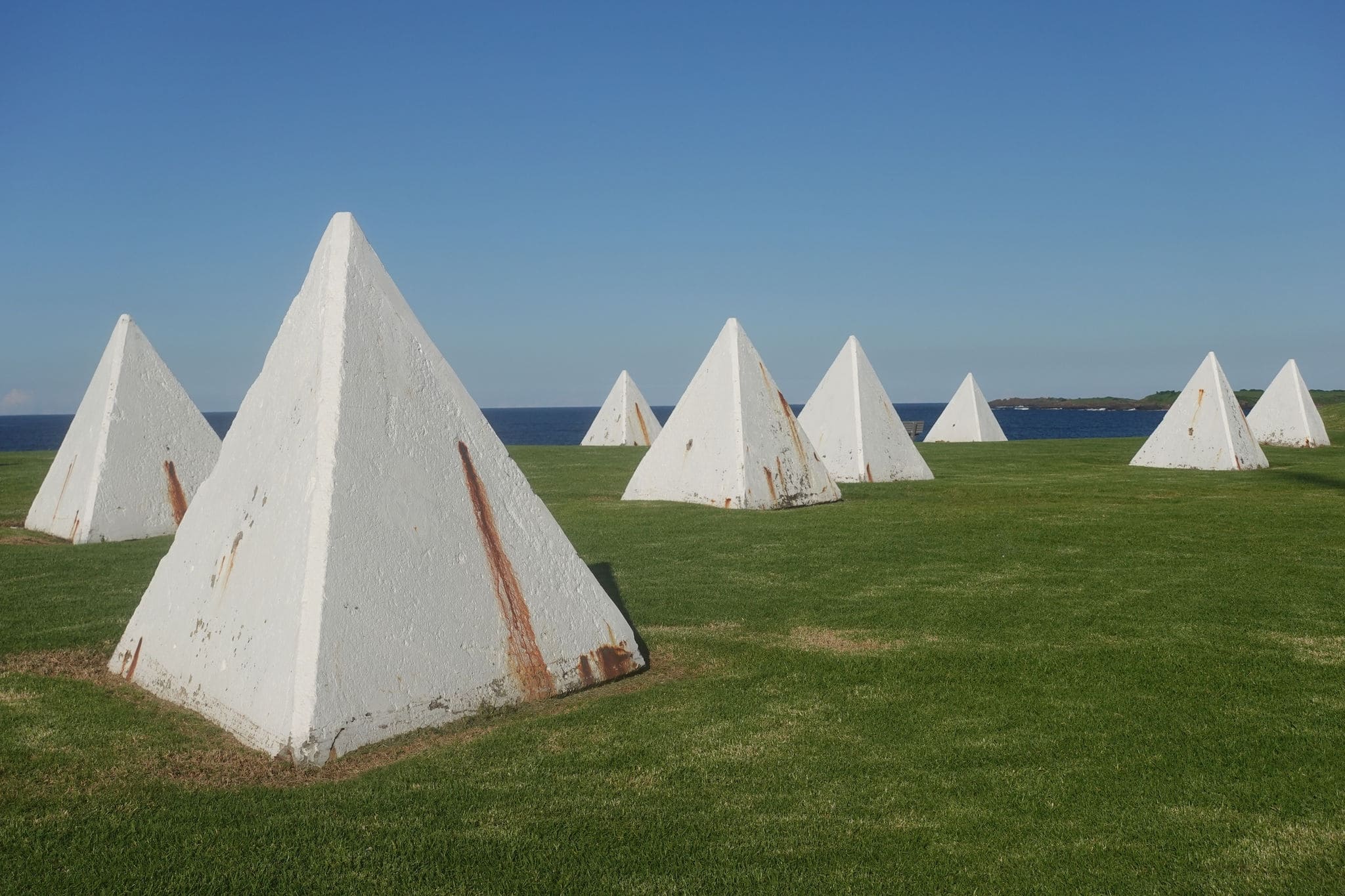 Huge concrete pyramids or triangles on the coast at Breakwater Battery, Port Kembla NSW Australia, used in WWII, as beach tank traps