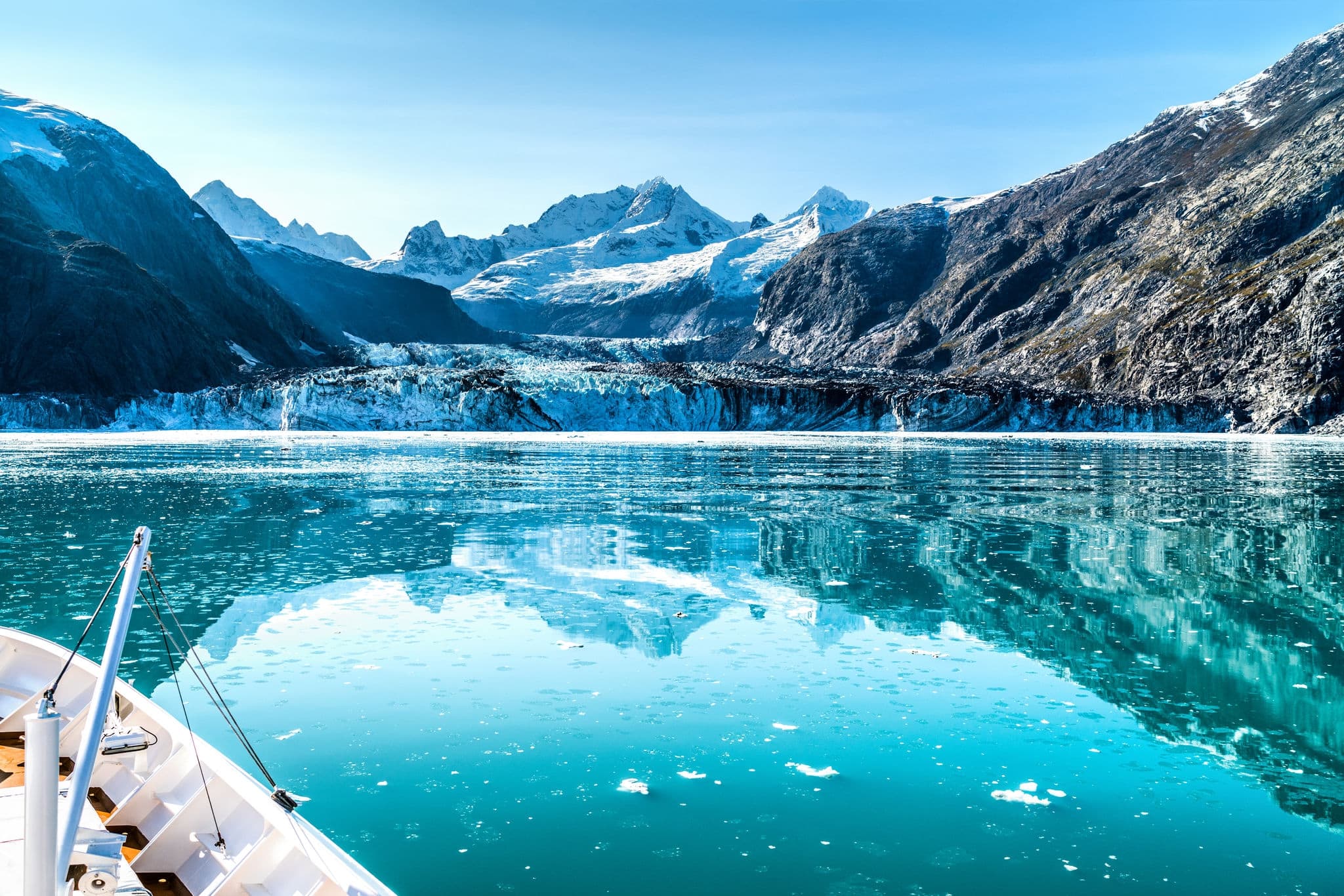 Cruise ship in Glacier Bay cruising towards Johns Hopkins Glacier in Alaska, USA. Panoramic view during summer.