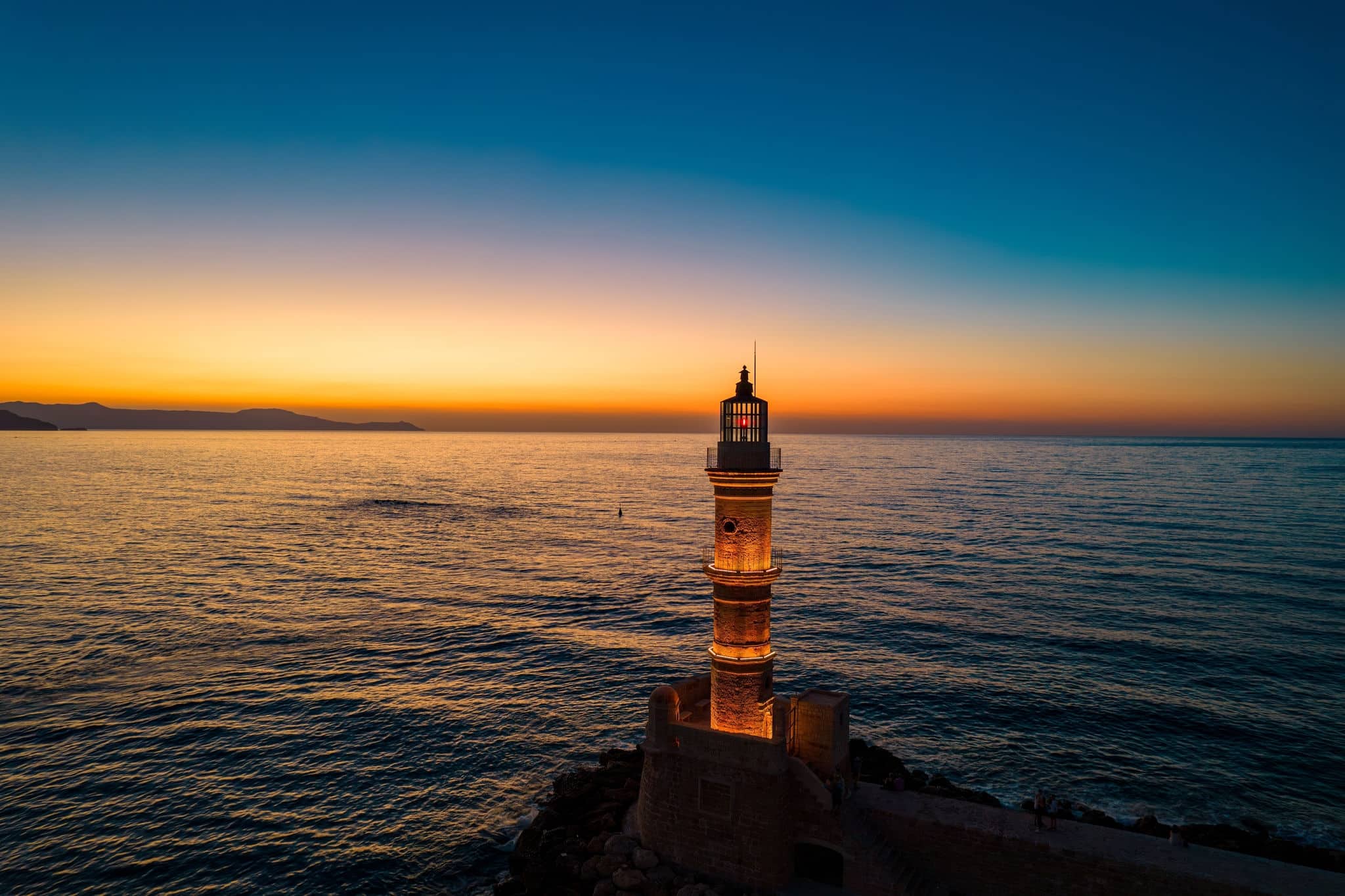 Aerial view  of the iconic old  lighthouse of  chania, Crete, Greece during sunset