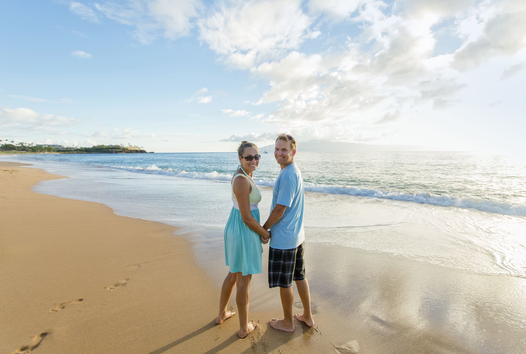 Couple in love walking along the beach together