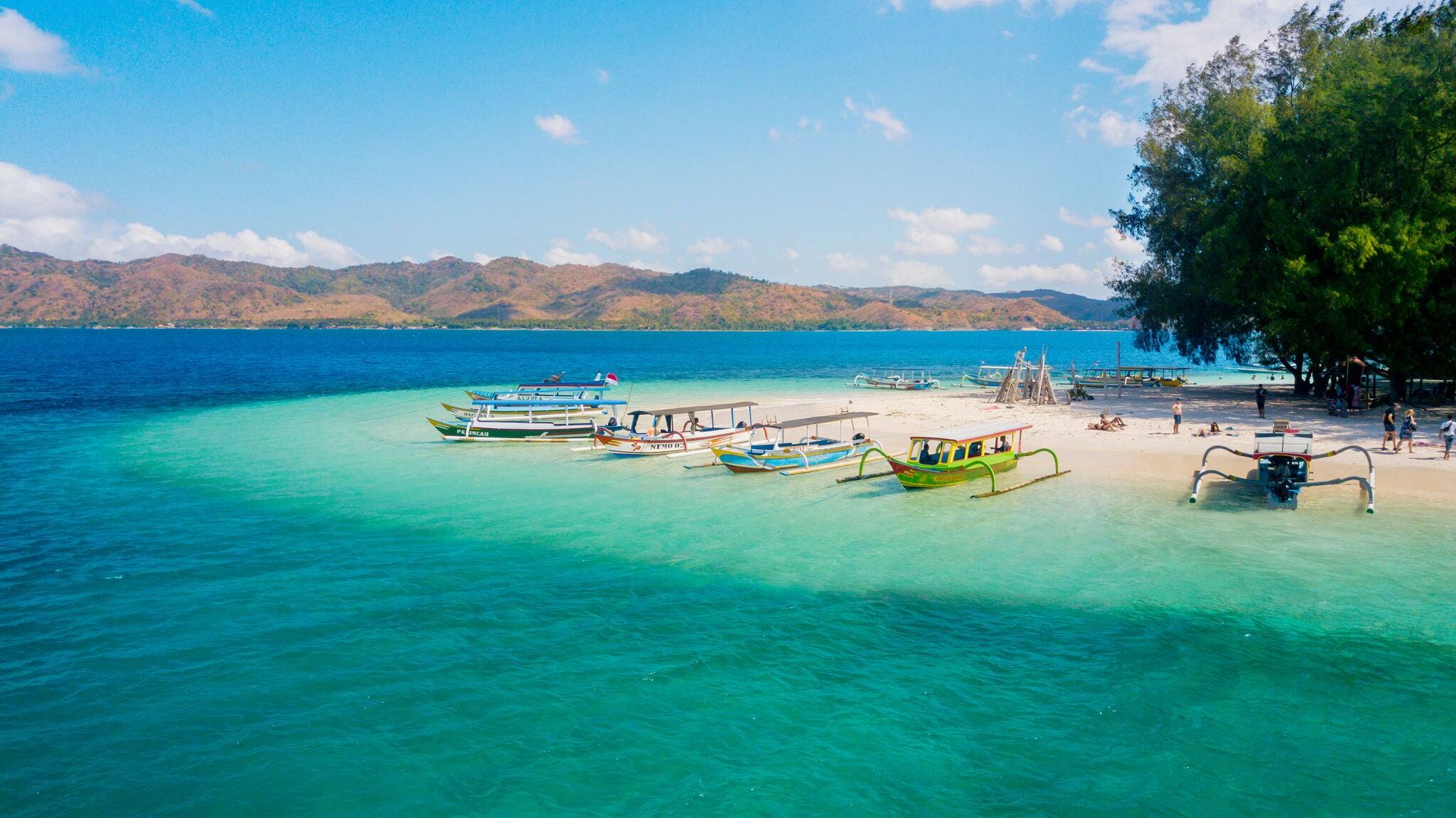 Beautiful scenery of tourist boats moored on the Gili Rengit island. Shot in the Lombok, Indonesia