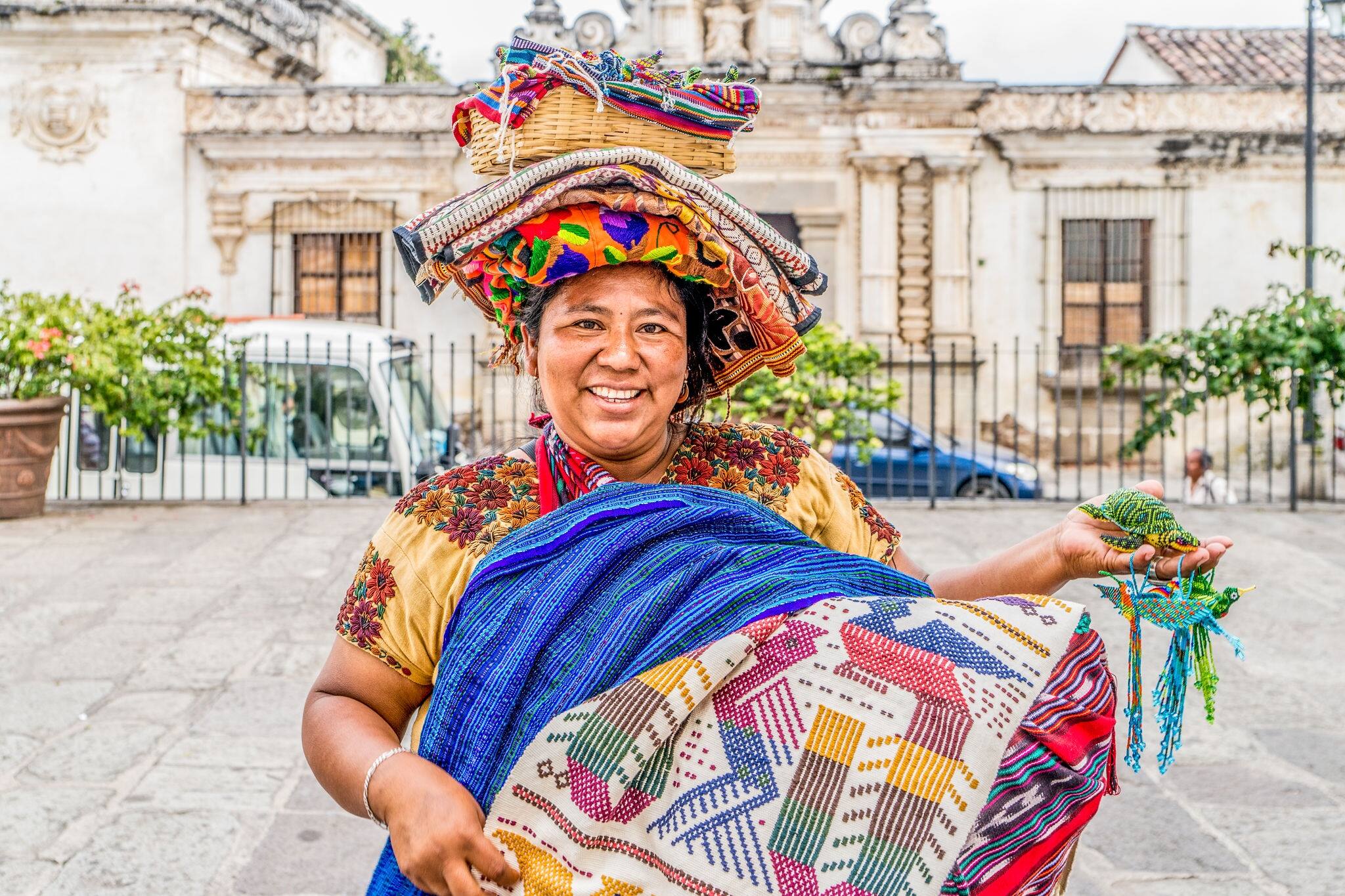 PUERTO QUETZAL, GUATEMALA - June 13, 2017: Indigenous Mayan market women sell handicrafts to international tourists in the streets and parks of Puerto Quetzal, Guatemala.