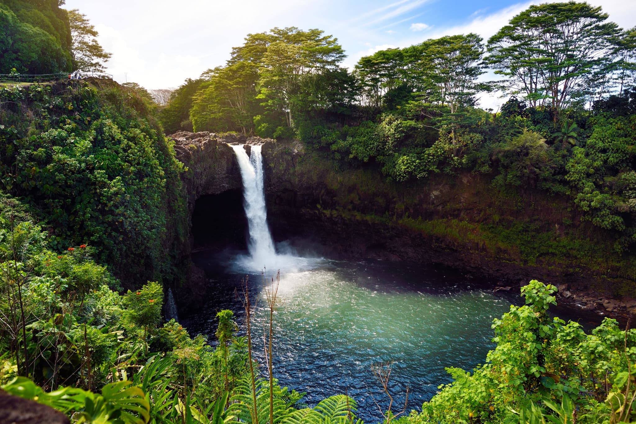 Hawaiin waterfall surrounded by jungle