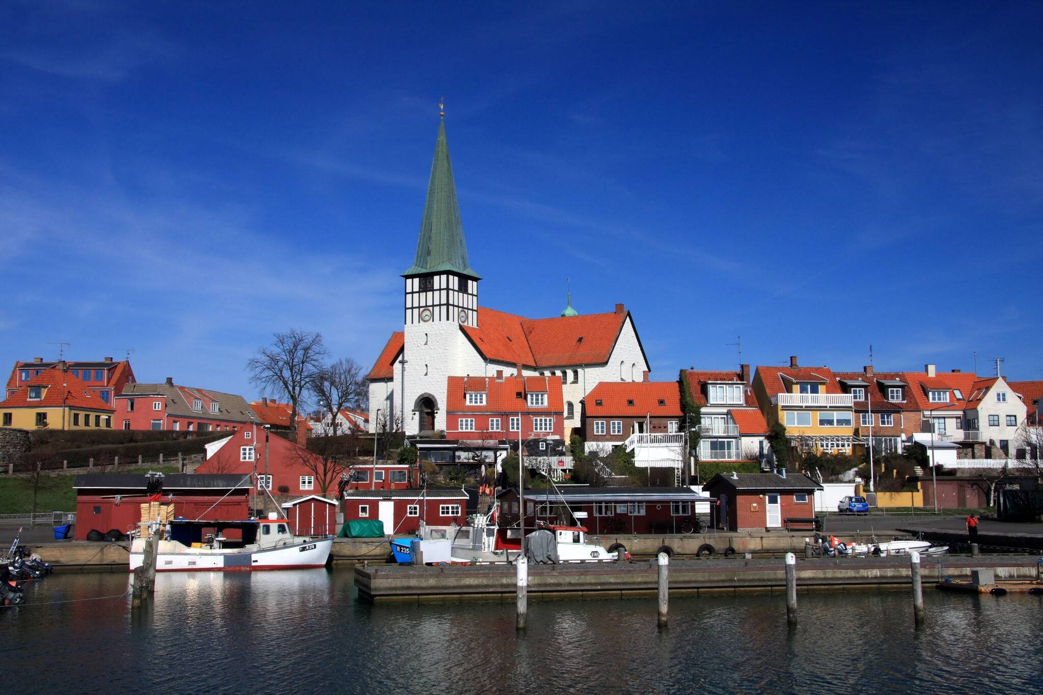 Ronne harbor and church seen from the sea, Bornholm, Denmark.