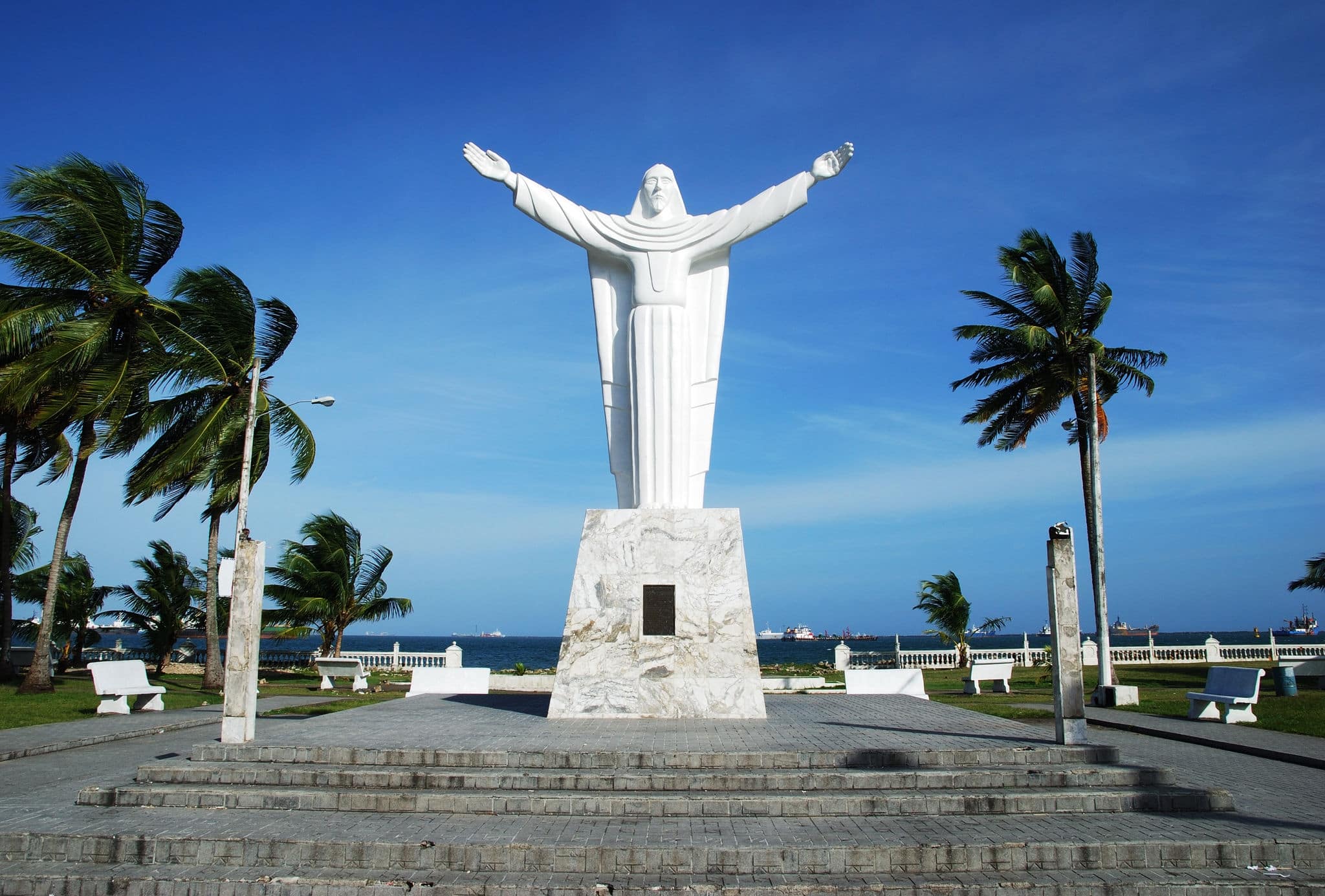 White statue of Christ in Colon city park, Panama.