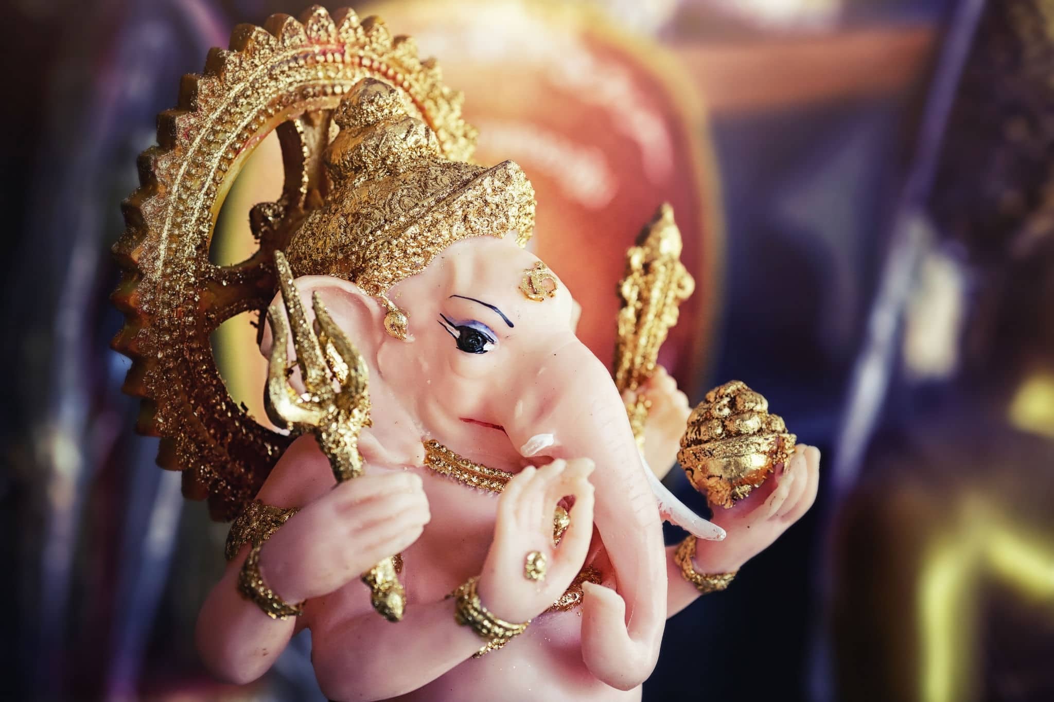 Close-up of hand crafted clay idol of Hindu god Ganesha - Lord of good omen in dramatic light