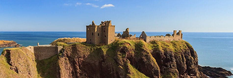 Dunnottar Castle with blue sky in - Stonehaven, Aberdeen, Scotland UK