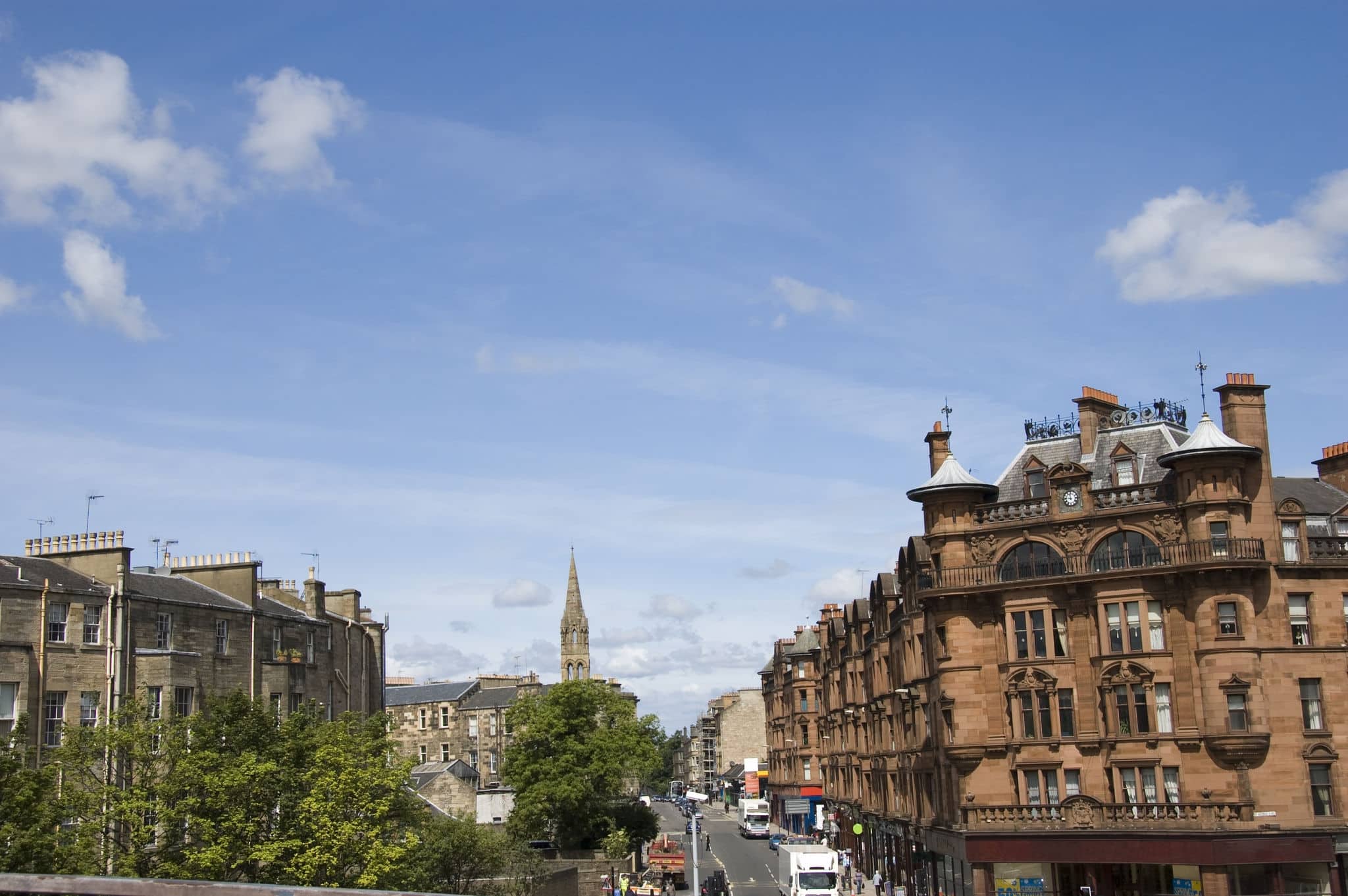 Red sandstone tenements at Charing Cross, Glasgow Scotland.   On the left hand side is rear view of tenements with grey brick