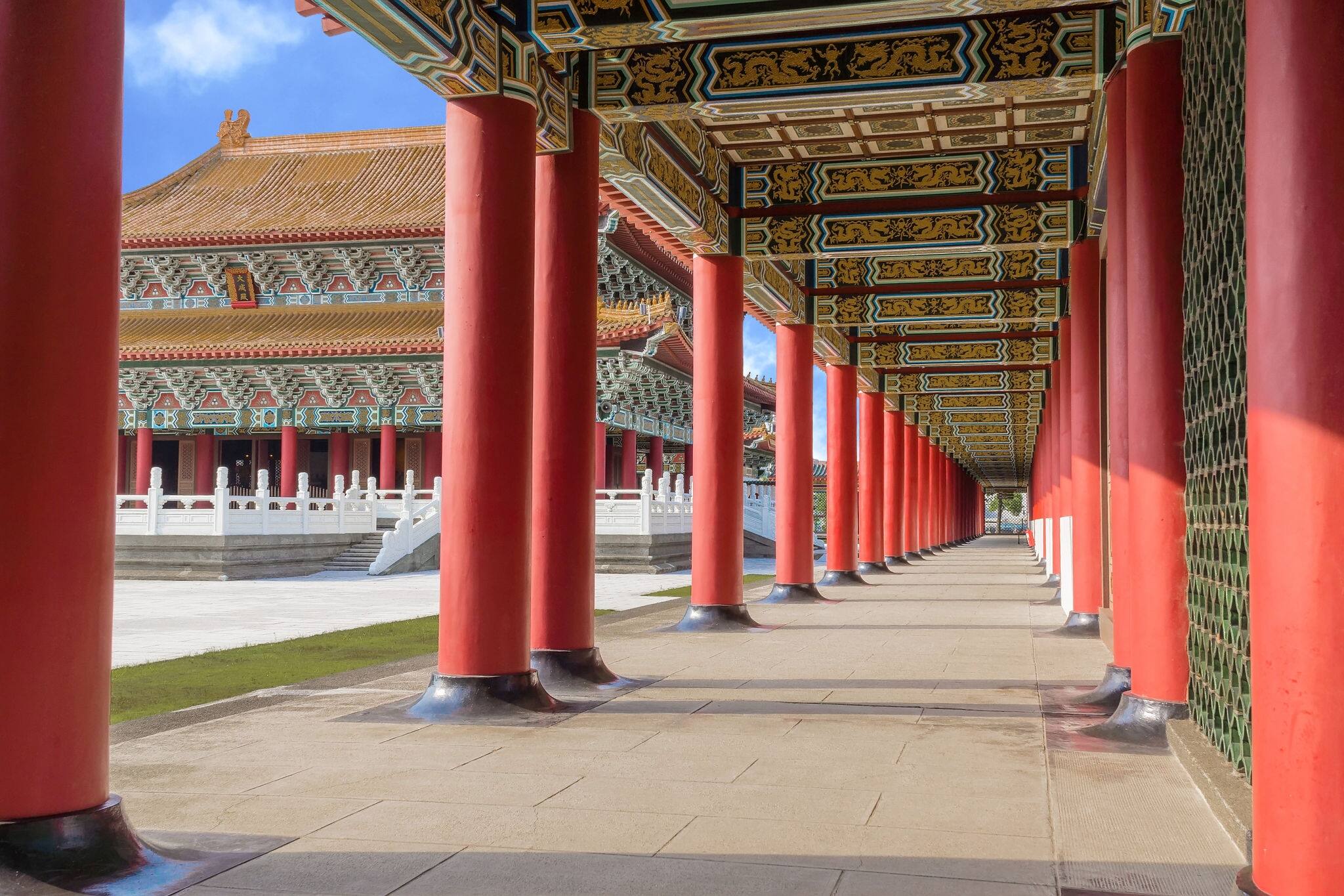 Perspective View of The Corridor of A Confucius Temple With The Main Temple Seen Between The Pillars.  A Typical Chinese Palace Architecture. A Tourist Site in Kaohsiung, Taiwan. 