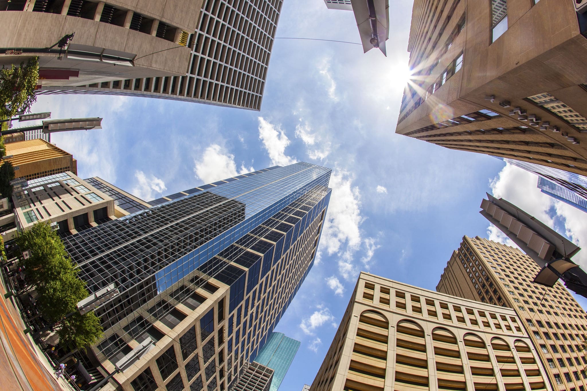 view to modern skyscraper in downtown Houston under blue sky