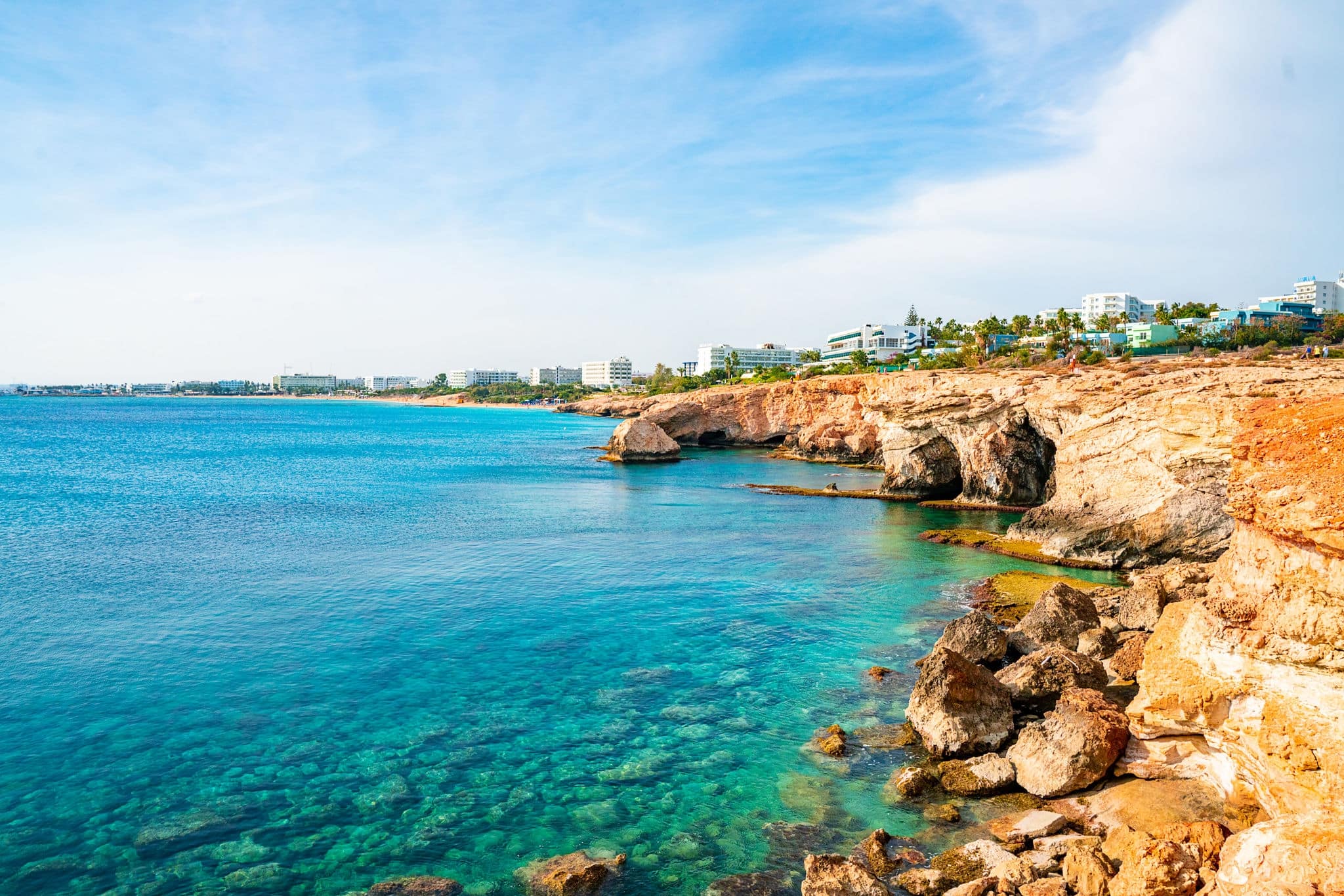 Tropical island cliff coast with ocean blue water and beautiful coastline.