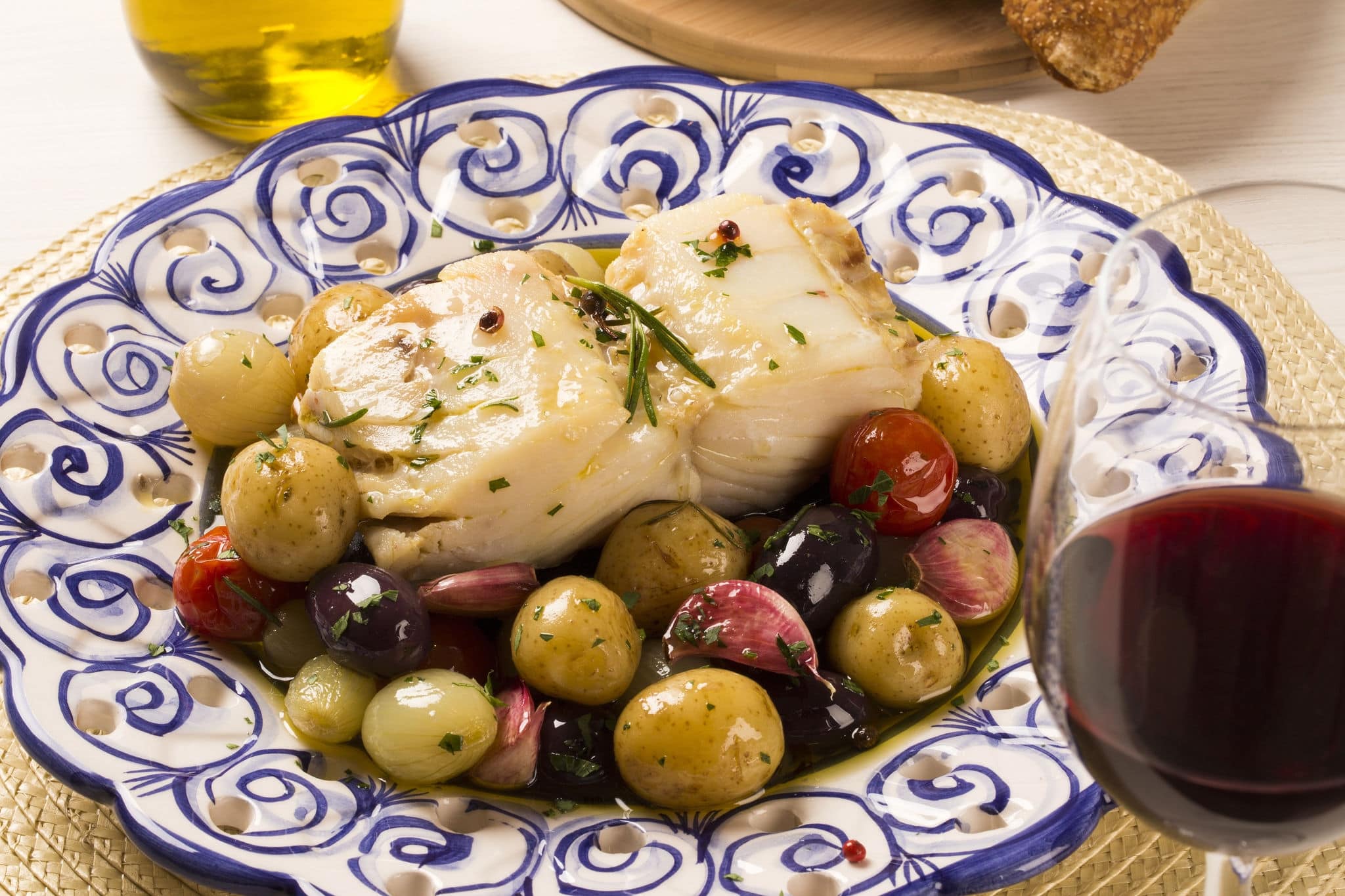 A typical Portuguese dish with codfish called Bacalhau do Porto in a original portuguese plate