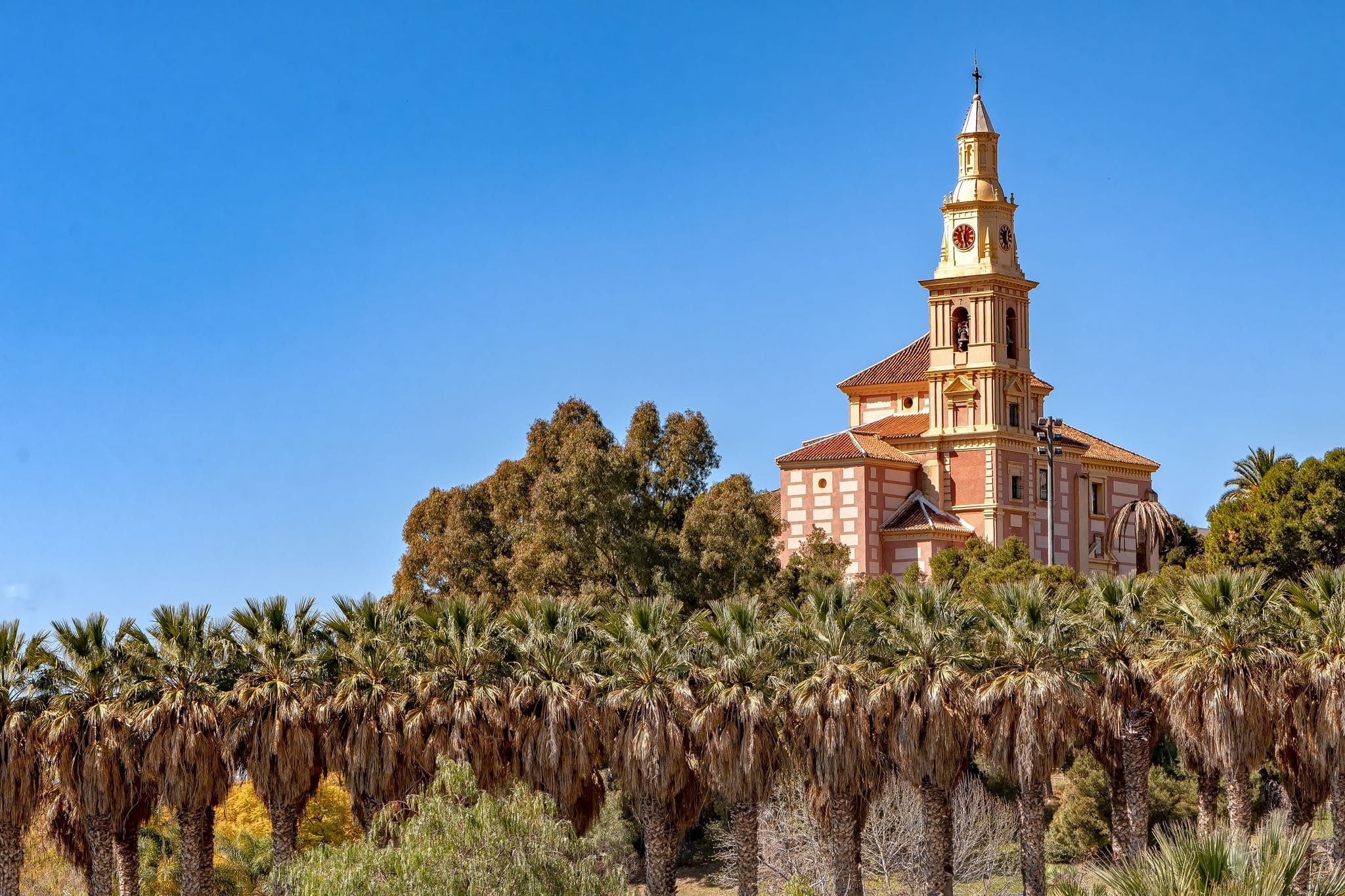 View of Virgen de la Cabeza church in Pueblos de America urban park in Motril, Granada, Spain.