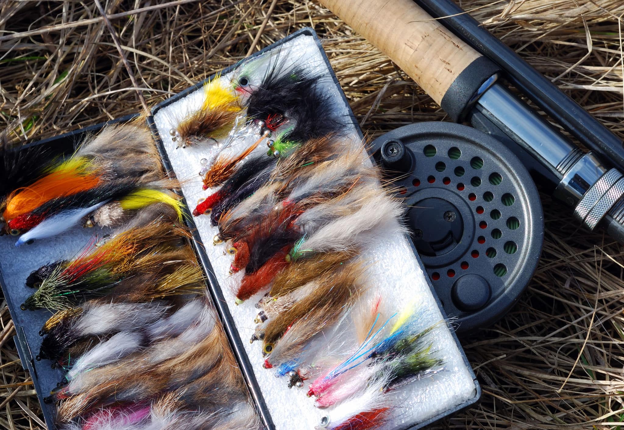 A collection of fly fishing flies and fly fishing rod
