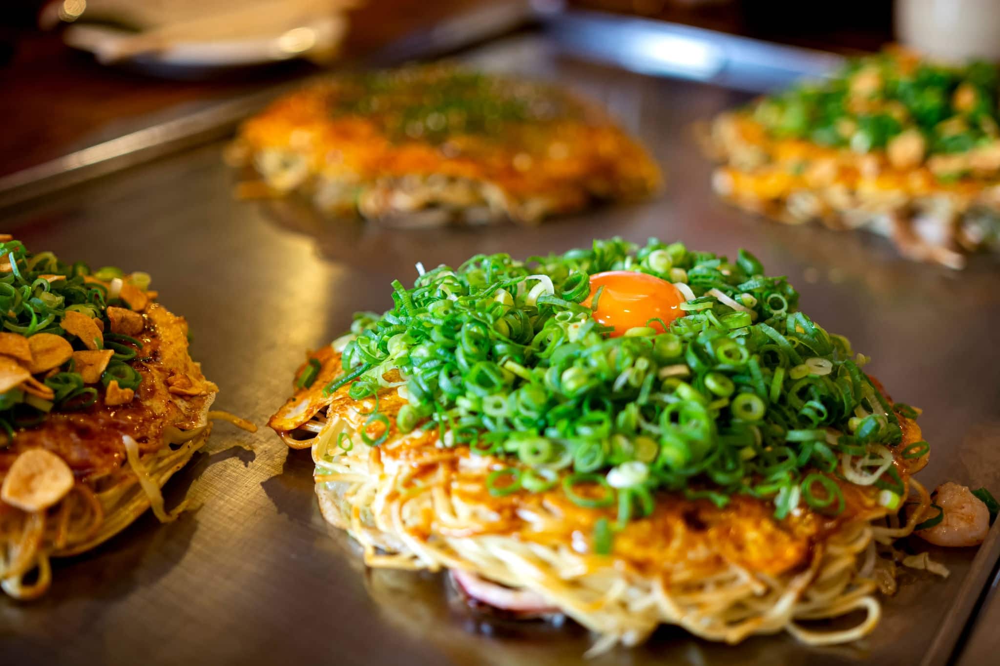 Okonomiyaki, Hiroshima food with egg, Japan 