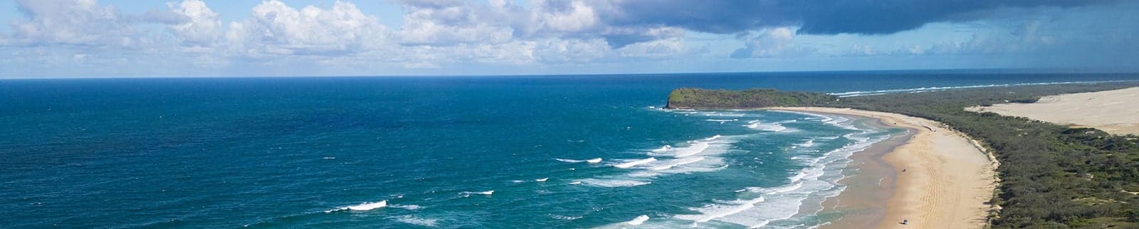 Aerial views of 75 Mile Beach highway on the sand island of K’gari, Queensland, Australia