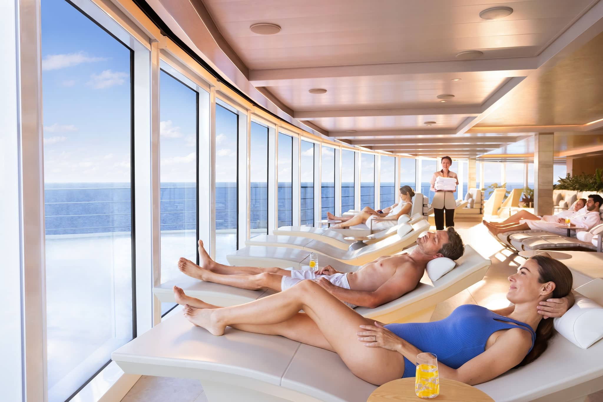 People relaxing on heated loungers in the Spa