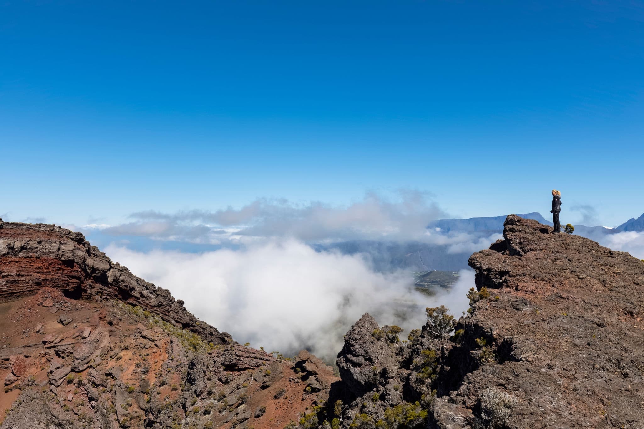 Reunion- reunion national park- tourist looking into crater le cratere commerson at route forestiere du volcan- view of la riviere des remparts