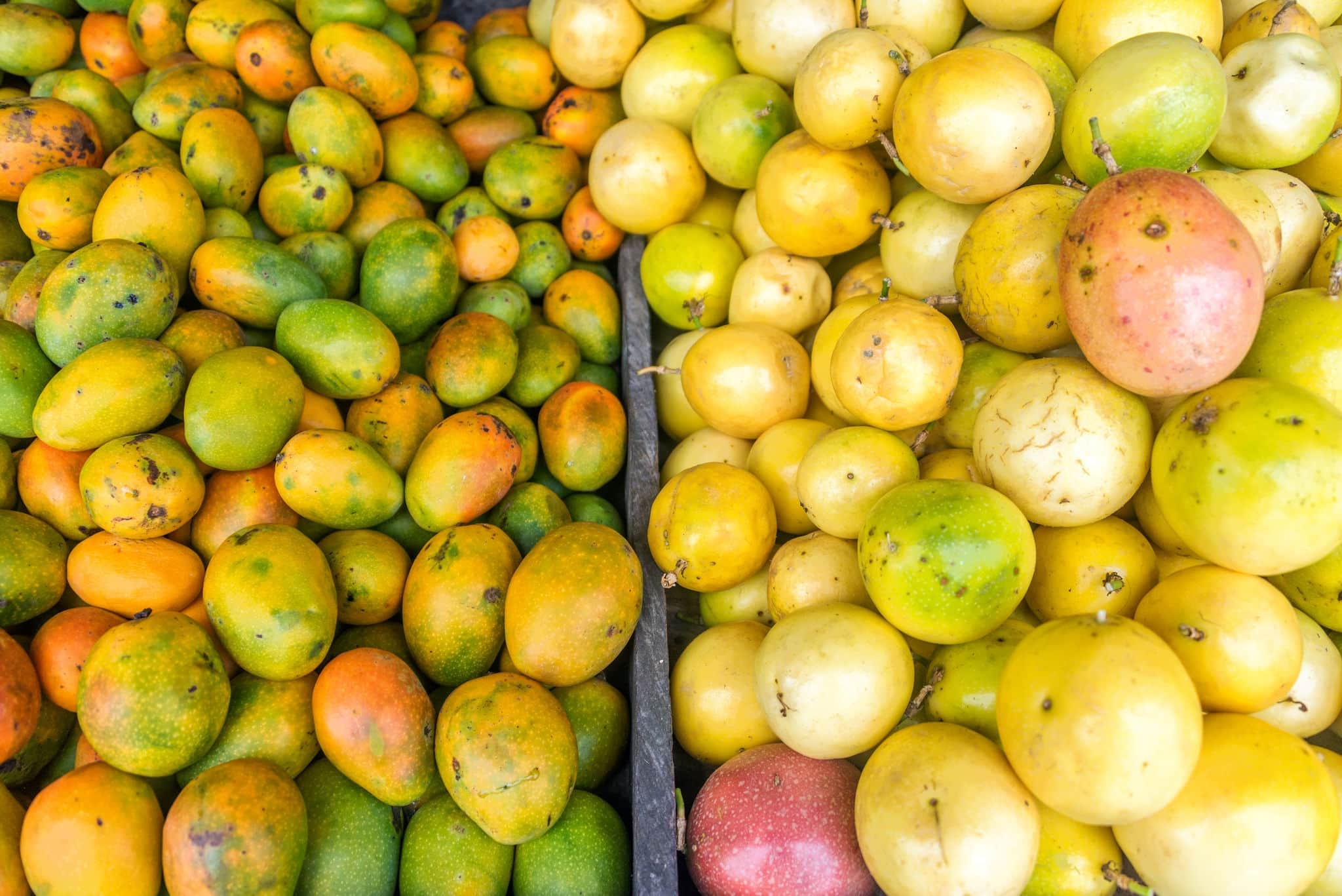 Fresh mangos and passion fruit at a market near Santa Marta Colombia